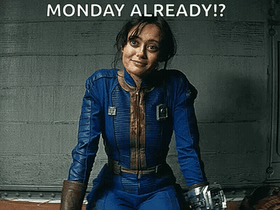 A Woman In A Blue Suit Is Sitting In Front Of A Wall With The Words Monday Already Written On It . GIF