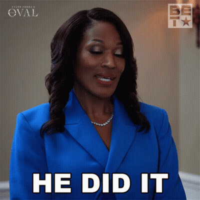 A Woman In A Blue Suit Is Smiling And Says He Did It GIF