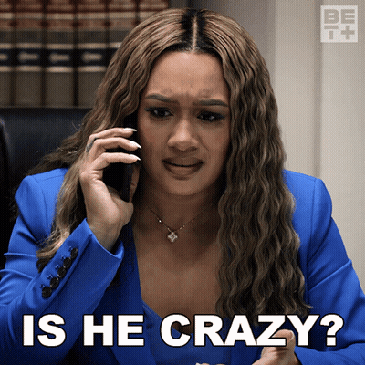A Woman In A Blue Suit Is Talking On A Cell Phone And Has The Words Is He Crazy Below Her GIF