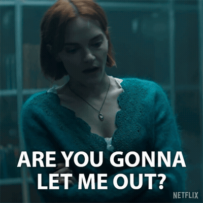A Woman In A Blue Sweater Is Asking Are You Gonna Let Me Out ? GIF