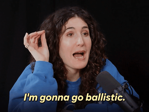 A Woman In A Blue Sweatshirt Says I 'M Gonna Go Ballistic In Front Of A Microphone GIF