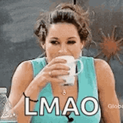 A Woman In A Blue Tank Top Is Drinking A Cup Of Coffee And Making A Funny Face . GIF