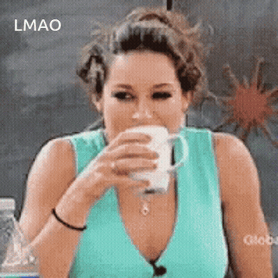 A Woman In A Blue Tank Top Is Drinking A Cup Of Coffee GIF
