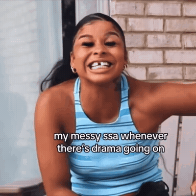 A Woman In A Blue Tank Top Is Laughing And Says " My Messy Ssa Whenever There 'S Drama Going On GIF