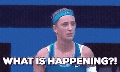 A Woman In A Blue Tank Top Is Standing On A Tennis Court And Asking What Is Happening . GIF