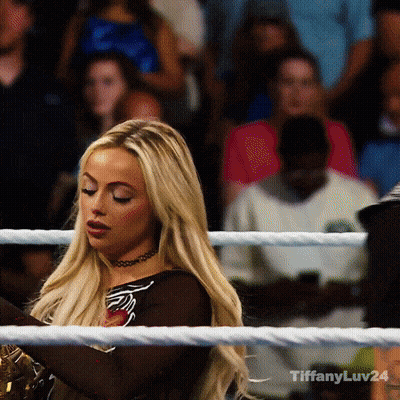 A Woman In A Boxing Ring With The Hashtag Tiffanyluv24 On The Bottom GIF