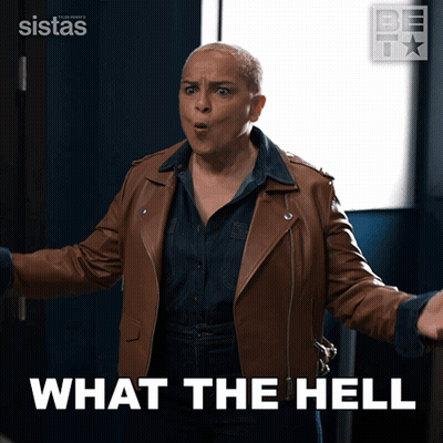 A Woman In A Brown Leather Jacket With The Words What The Hell Behind Her GIF