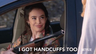 A Woman In A Car Holding A Shotgun Says I Got Handcuffs Too Netflix GIF
