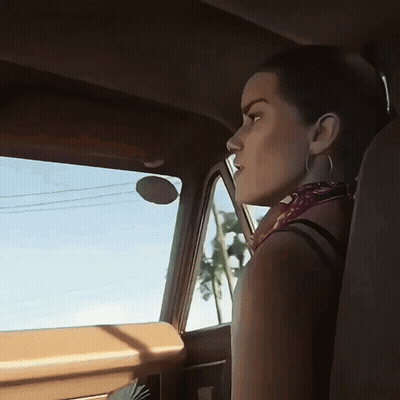 A Woman In A Car Looking Out The Window With A Palm Tree In The Background GIF