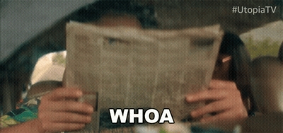 A Woman In A Car Reading A Newspaper With The Word Whoa Above Her Head GIF