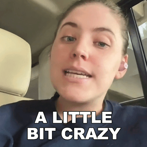 A Woman In A Car With The Words A Little Bit Crazy On The Bottom GIF