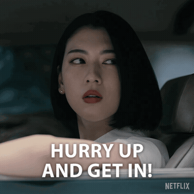 A Woman In A Car With The Words Hurry Up And Get In Behind Her GIF