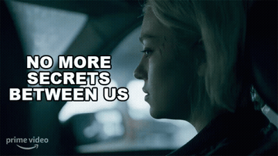 A Woman In A Car With The Words No More Secrets Between Us GIF