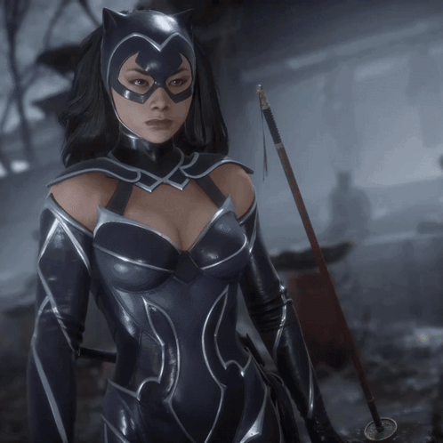 A Woman In A Catwoman Costume Holds A Sword GIF