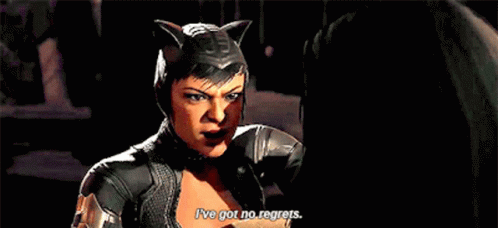 A Woman In A Catwoman Costume Is Talking To Another Woman . GIF