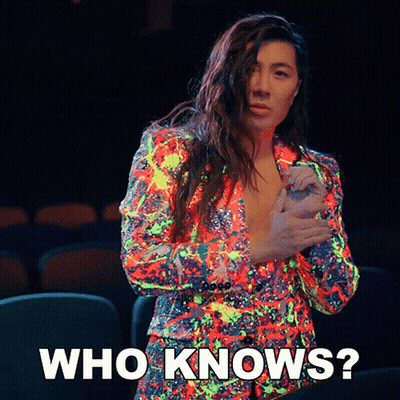 A Woman In A Colorful Jacket Is Asking Who Knows GIF