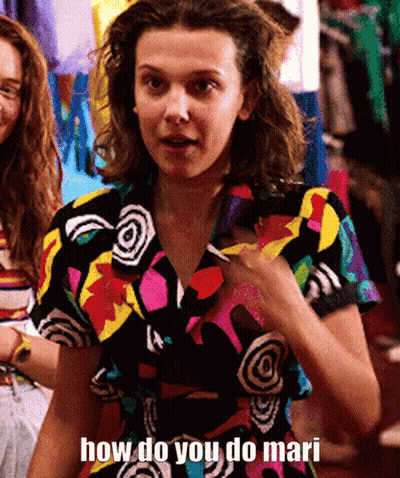A Woman In A Colorful Shirt Is Asking How Do You Do Mari . GIF