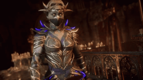 A Woman In A Costume Is Holding A Blue Object GIF