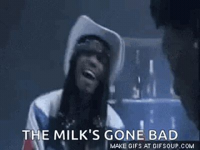 A Woman In A Cowboy Hat Is Smoking A Cigarette And Says `` The Milk 'S Gone Bad `` . GIF