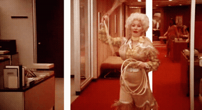 A Woman In A Cowboy Outfit Holds A Lasso GIF