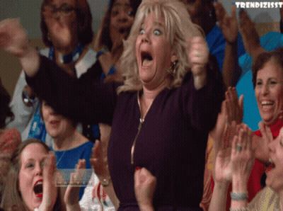 A Woman In A Crowd With The Word Trendizissy Written On The Bottom GIF