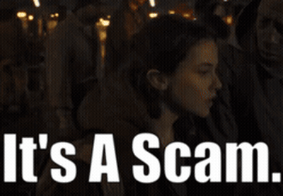 A Woman In A Crowd With The Words It 'S A Scam GIF