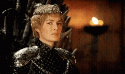 A Woman In A Crown Is Sitting On A Throne . GIF