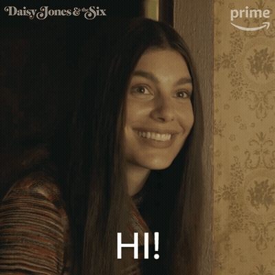 A Woman In A Daisy Jones & The Six Advertisement GIF