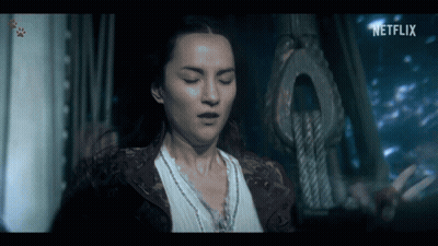 A Woman In A Dark Room With A Netflix Logo On The Bottom GIF