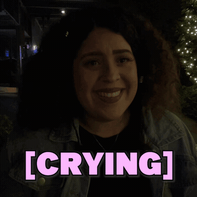 A Woman In A Dark Room With The Word Crying Above Her GIF