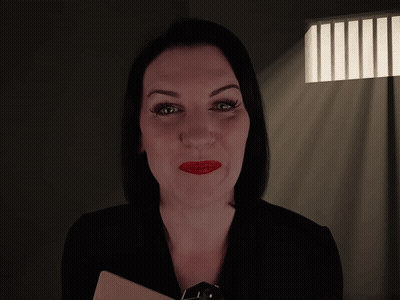 A Woman In A Dark Room With The Words " How Long Have You Been Possessed " Above Her GIF