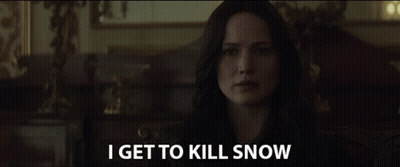 A Woman In A Dark Room With The Words I Get To Kill Snow Above Her GIF