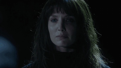 A Woman In A Dark Room With The Words " Not Anymore " Behind Her GIF