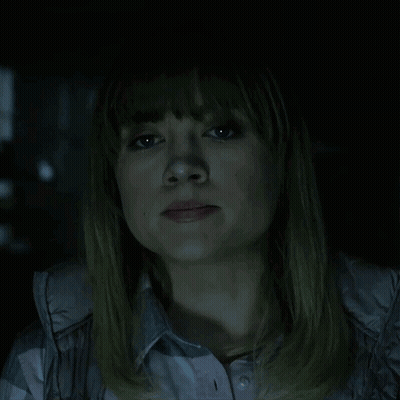 A Woman In A Dark Room With The Words Of Course Written Above Her GIF