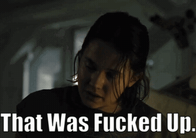 A Woman In A Dark Room With The Words That Was Fucked Up Above Her GIF