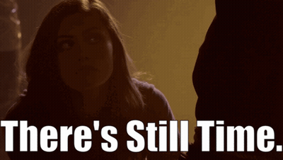 A Woman In A Dark Room With The Words There 'S Still Time GIF