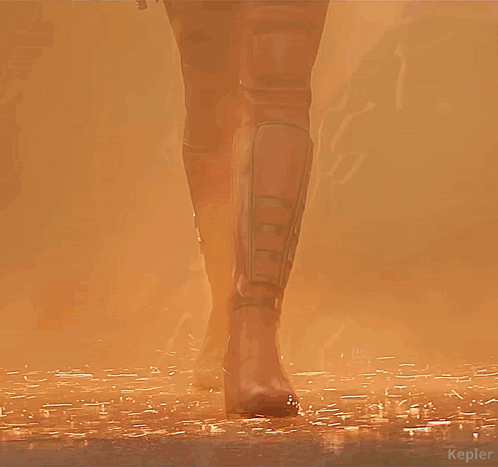 A Woman In A Deadpool Costume Holds Two Guns In Her Hands GIF