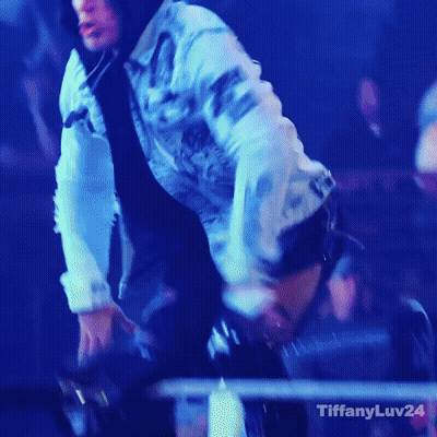 A Woman In A Denim Jacket Is Dancing In Front Of A Crowd And The Words Tiffanyluv24 Are On The Bottom GIF