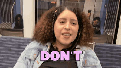 A Woman In A Denim Jacket Says " Don 'T " GIF
