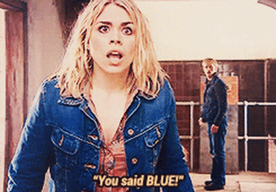 A Woman In A Denim Jacket Says " You Said Blue " While A Man Stands Behind Her GIF