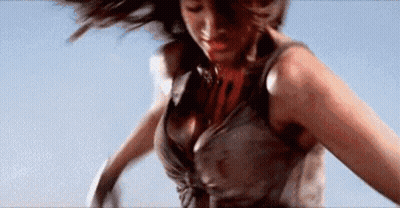 A Woman In A Dirty Dress Is Jumping In The Air . GIF