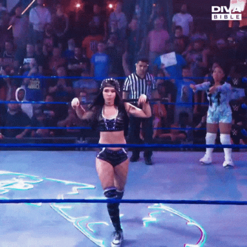 A Woman In A Diva Bible Wrestling Ring Is Dancing GIF
