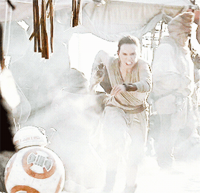 A Woman In A Dress Is Fighting A Bb-8 Robot GIF
