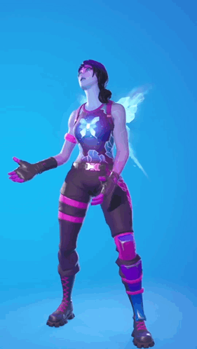 A Woman In A Fairy Costume Is Standing In Front Of A Blue Sky GIF
