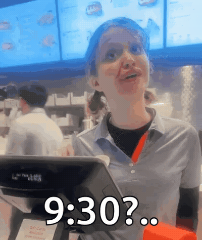 A Woman In A Fast Food Restaurant Behind A Counter Says 9:30 GIF