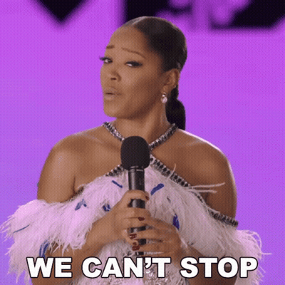 A Woman In A Feathered Dress Is Holding A Microphone And Saying We Can 'T Stop GIF
