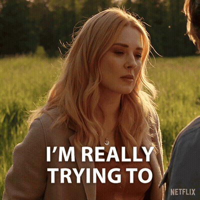 A Woman In A Field With The Words I 'M Really Trying To GIF