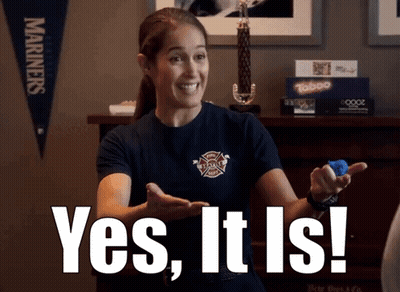 A Woman In A Firefighter Shirt Is Holding A Blue Object And Says Yes It Is GIF