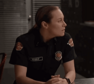 A Woman In A Firefighter Uniform Has The Name T. Bishop On Her Badge GIF