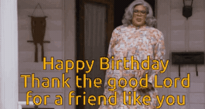 A Woman In A Floral Dress Is Standing In Front Of A Door With The Words Happy Birthday Thank The Good Lord For A Friend  GIF